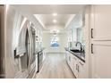 Bright, open kitchen featuring modern stainless steel appliances and granite countertops at 1713 E Morelos St, Chandler, AZ 85225