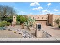 Property featuring a well-maintained desert landscape and an inviting facade at 18944 E Amethyst Dr, Rio Verde, AZ 85263