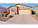 Single-story home featuring an attached garage, well-kept landscaping and appealing curb appeal at 19990 W Turney Ave, Litchfield Park, AZ 85340