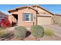 Inviting home with desert landscaping, a charming exterior, and a cozy front entrance at 19990 W Turney Ave, Litchfield Park, AZ 85340