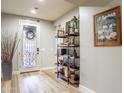 Inviting entryway with decorative door, stylish shelving, and neutral color palette for a modern touch at 20138 E Estrella Rd, Queen Creek, AZ 85142