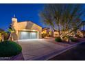 Inviting single-story home with a well-kept front yard, two-car garage, and desert landscaping at 22813 N Del Monte Dr, Sun City West, AZ 85375