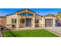 Home featuring an inviting covered front entrance and well-kept lawn at 2638 E Edgemont Ave, Phoenix, AZ 85008