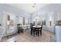 Bright breakfast nook with plantation shutters, light fixture, and seating for four at 2922 E Encanto St, Mesa, AZ 85213