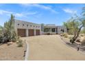 Beautiful Southwestern home with a three-car garage, complemented by drought-tolerant desert landscaping at 30600 N Pima Rd # 24, Scottsdale, AZ 85266