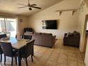 Inviting living room featuring tiled floors, neutral walls, ceiling fan, and a cozy seating area at 4101 E Nancy Ln, Phoenix, AZ 85042