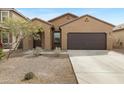 Inviting single-story home featuring a neutral exterior and a well-kept front yard at 47737 W Coe St, Maricopa, AZ 85139