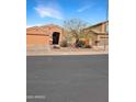 Inviting single-story home featuring desert landscaping, a two-car garage, and neutral exterior at 528 E Wolf Hollow Dr, Casa Grande, AZ 85122