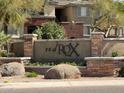 Red Rox Condominium Residences sign surrounded by desert landscaping and stone accents at 5401 E Van Buren St # 2053, Phoenix, AZ 85008