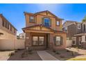 Beautiful two-story home with desert landscaping, offering inviting curb appeal at 5828 E Hoover Ave, Mesa, AZ 85206