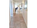 Inviting hallway with tile floors, leading to a bright living area with neutral walls at 8020 E Keats Ave # 271, Mesa, AZ 85209