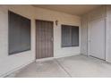 Covered patio entry features security door, screen windows, and small storage closet at 11666 N 28Th Dr # 196, Phoenix, AZ 85029