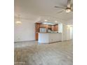 Open floor plan showcasing kitchen with breakfast bar and stainless steel appliances at 11666 N 28Th Dr # 196, Phoenix, AZ 85029