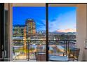 Balcony view overlooking the city skyline with distant mountains and bright city lights at dusk at 16 W Encanto Blvd # 616, Phoenix, AZ 85003