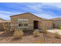 Attractive single-story home with a low-maintenance landscape and a welcoming entrance at 18449 E Eloisa Dr, Gold Canyon, AZ 85118