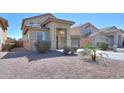 Beautiful home featuring desert landscaping, a tile roof, and a two-car garage in a desirable neighborhood at 44115 W Palmen Dr, Maricopa, AZ 85138