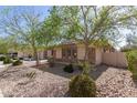 Single-Gathering home with beautiful desert landscaping with rock ground cover at 5721 W Molly Ln, Phoenix, AZ 85083