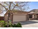 Single-Gathering home with a two-car garage, and well manicured desert landscaping at 5721 W Molly Ln, Phoenix, AZ 85083
