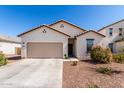 Beautiful single-story home with a two-car garage and desert-friendly landscaping at 5875 N 195Th Dr, Litchfield Park, AZ 85340