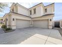 Spacious three-car garage with an expansive driveway, offering ample parking at 7745 E Calle De Las Brisas --, Scottsdale, AZ 85255