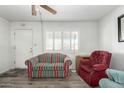 Cozy living room with bright natural light and durable laminate flooring at 849 E Lancaster Cir, Florence, AZ 85132