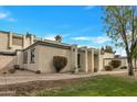 A clean-looking single-story home in a well-kept community with desert landscaping at 9036 N 51St Ln, Glendale, AZ 85302