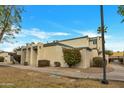 Attractive single story home featuring a well-kept lawn and desert-friendly plantings at 9036 N 51St Ln, Glendale, AZ 85302