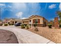 Lovely single-story home featuring desert landscaping, stone accents, and a two-car garage at 9302 W Georgia Ave, Glendale, AZ 85305