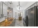 Open kitchen with sleek appliances, granite countertops, and convenient dining area, ideal for modern living at 974 E Palomino Way, San Tan Valley, AZ 85143