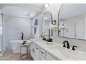 Luxurious bathroom with a soaking tub, double vanity, and modern fixtures at 1012 E Rosebud Dr, San Tan Valley, AZ 85143