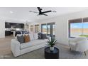 Bright living room featuring modern decor, natural light, and an open-concept design at 1012 E Rosebud Dr, San Tan Valley, AZ 85143