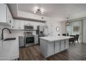 Stylish kitchen featuring stainless appliances, white cabinets, and an island perfect for entertaining at 18250 N Cave Creek Rd # 164, Phoenix, AZ 85032