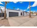 Contemporary home featuring a white exterior, gray accents, desert landscaping and attached garage at 1847 W Isleta Ave, Mesa, AZ 85202