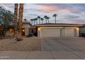 Beautiful home with a large 3-car garage and meticulously xeriscaped front yard at 20029 N Coronado Ridge Dr, Surprise, AZ 85387