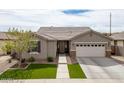 Charming single-Gathering home features desert landscaping, artificial turf, and a two-car garage at 3121 N Loma Vista Dr, Mesa, AZ 85213