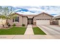 Single-Gathering home boasting a well-maintained lawn, desert landscaping, and a two-car garage at 3121 N Loma Vista Dr, Mesa, AZ 85213