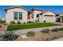 Beautiful home featuring a well-maintained lawn and attractive desert landscaping at 4834 S Meteor --, Mesa, AZ 85212