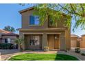 Inviting two-story home showcases classic architecture and well-maintained landscaping, enhancing its curb appeal at 559 E Rainbow Dr, Chandler, AZ 85249