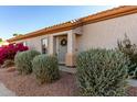 Charming home featuring manicured front yard landscaping and a welcoming entrance at 5826 E Nathan St, Mesa, AZ 85215