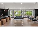 Open game room featuring a pool table, bar area, and outdoor views at 6216 N 38Th Pl, Paradise Valley, AZ 85253