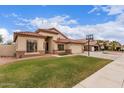 Well maintained home featuring a two-car garage, beautiful tile roof, and a basketball hoop at 7235 W Dreyfus Dr, Peoria, AZ 85381