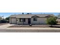 Inviting one-story home boasts a tidy yard, and a freshly painted exterior, creating a welcoming curb appeal at 1001 W 17Th St, Tempe, AZ 85281