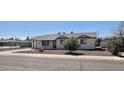 Attractive home features a well-kept yard with mature trees, providing shade and curb appeal at 1001 W 17Th St, Tempe, AZ 85281