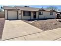 Well-maintained single-Gathering house featuring a driveway and nicely landscaped front yard at 1001 W 17Th St, Tempe, AZ 85281