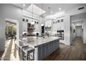 Bright kitchen boasts a large island, modern appliances, and plenty of counter space at 10800 E Cactus Rd # 7, Scottsdale, AZ 85259
