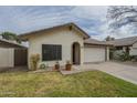 Charming single-story home with a two-car garage and a welcoming front entrance at 12243 S Chippewa Dr, Phoenix, AZ 85044