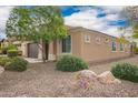 Well-kept front exterior with neat landscaping showcasing beautiful curb appeal at 12957 W Hummingbird Ter, Peoria, AZ 85383