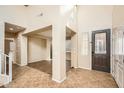 Spacious entryway featuring tile flooring, high ceilings, and neutral paint at 14544 W Sierra St, Surprise, AZ 85379