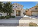 Charming home with a covered porch, a bench, and desert landscaping at 18841 E Pelican Ct, Queen Creek, AZ 85142