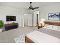 Serene main bedroom with a ceiling fan, neutral tones, and stylish furniture at 3316 W Hayduk Rd, Laveen, AZ 85339